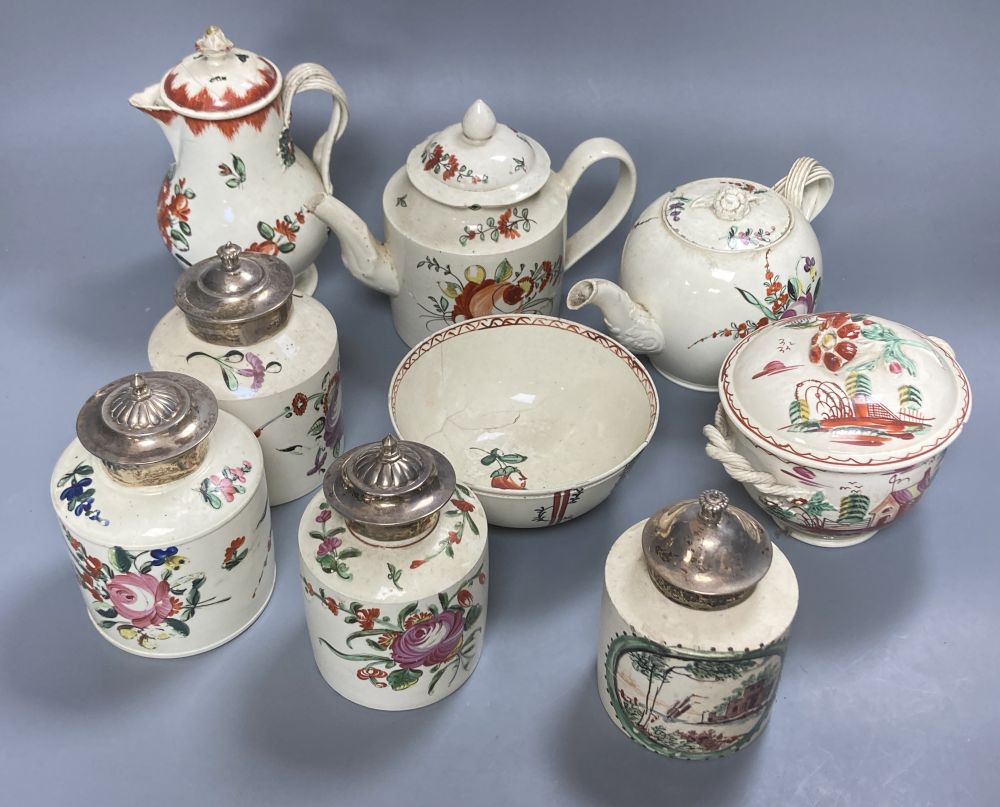 A collection of nine pieces of late 18th century creamware, including bullet-shaped teapot, 11cm high and four tea canisters with silve